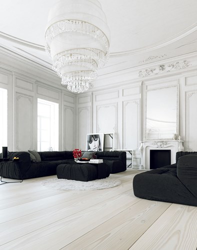 Ghế sofa màu đen kết hợp với tường trang trí cầu kỳ, phủ sơn trắng là cách hoàn hảo để mang đến một phòng khách phong cách cổ điển đúng nghĩa