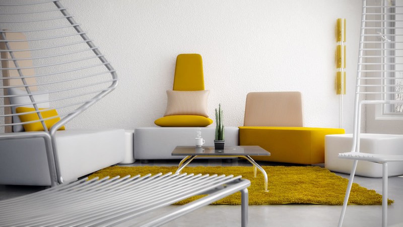 Phòng khách nổi bật với chiếc thảm trải sàn nhà và ghế sofa màu vàng.