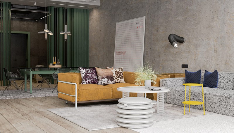 Ghế sofa màu cam nổi bật trên nền tường bê tông đơn giản. Hai chiếc bàn trà màu trắng và vàng cũng góp phần tạo nên diện mạo khác lạ cho căn phòng khách.