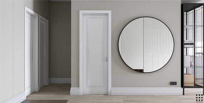 Tại hành lang, chủ nhà gắn một chiếc gương tròn để tăng kích thước cho những căn phòng bên trong.