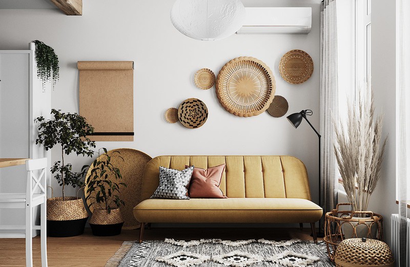 Ghế sofa màu nâu nhạt phù hợp với màu sắc của những vật dụng trang trí bằng mây tre đan trong phòng