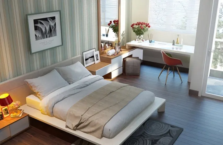 Giấy dán tường màu xanh nhẹ nhàng và các điểm nhấn màu đỏ ấn tượng cho thấy khía cạnh giản dị và thoải mái của thiết kế