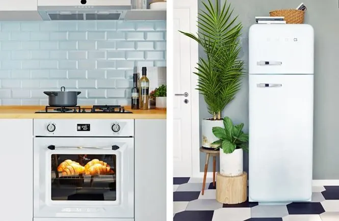 Tủ lạnh đặt gọn gàng sát tường bên cạnh chậu cây trang trí, tường nhà bếp ốp đá màu xanh mang lại cái nhìn tươi sáng cho khu vực này