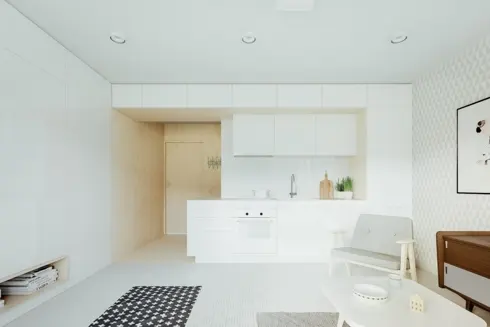 Chiếc thảm màu đen có vân kẻ trắng đã làm nổi bật cho căn phòng có tủ bếp, tường, trần và sàn nhà đều là màu trắng