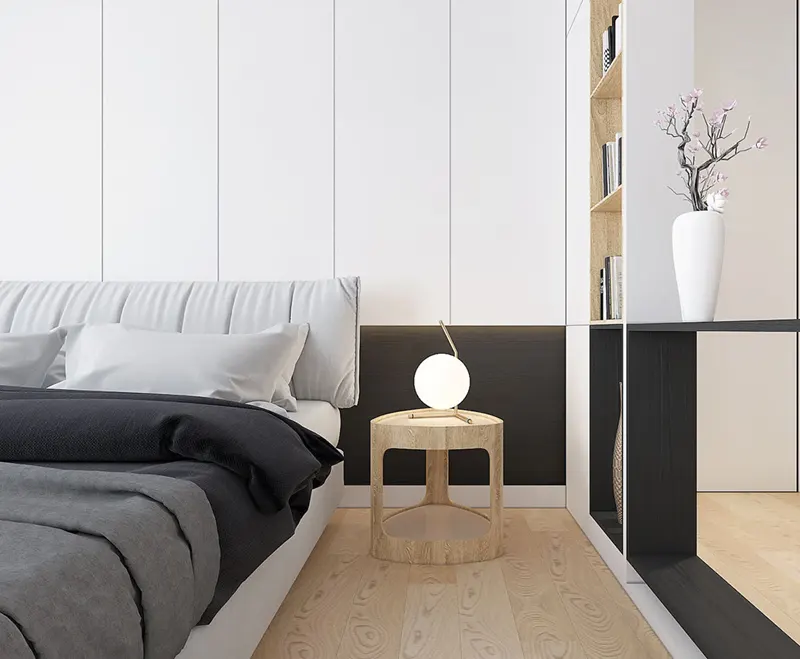 Một chiếc đèn ngủ nhỏ đặt trên bàn cạnh giường dùng để đọc sách