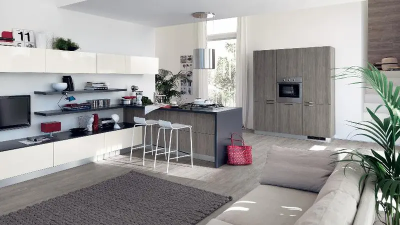 Tủ tivi kéo dài đến tận bếp tăng diện tích lưu trữ.
