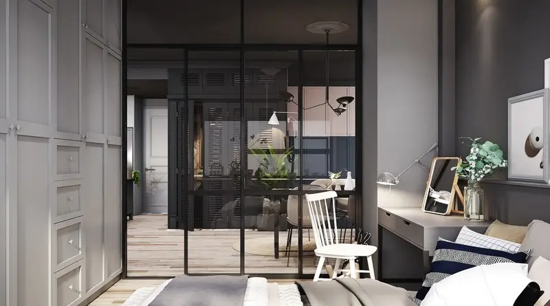 Một bàn trang điểm đặt giữa giường và tường kính. Cửa trượt không chiếm diện tích giúp cho phòng ngủ luôn yên tĩnh.
