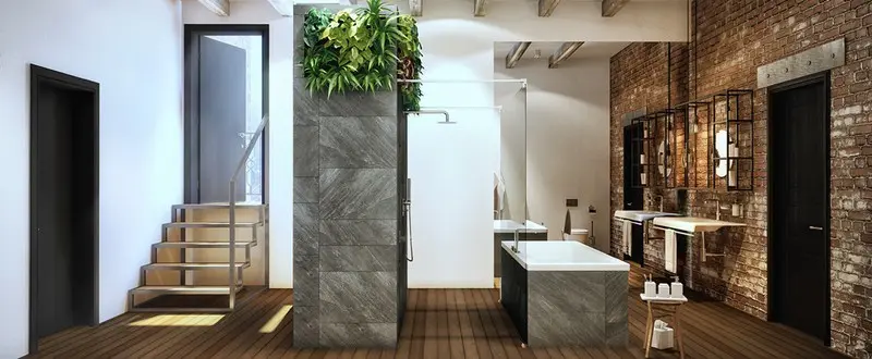 Bồn tắm ốp đá đi kèm tường gạch thô, một sự kết hợp đầy ngẫu hứng mang đến không gian phòng tắm hiện đại và có chút công nghiệp.