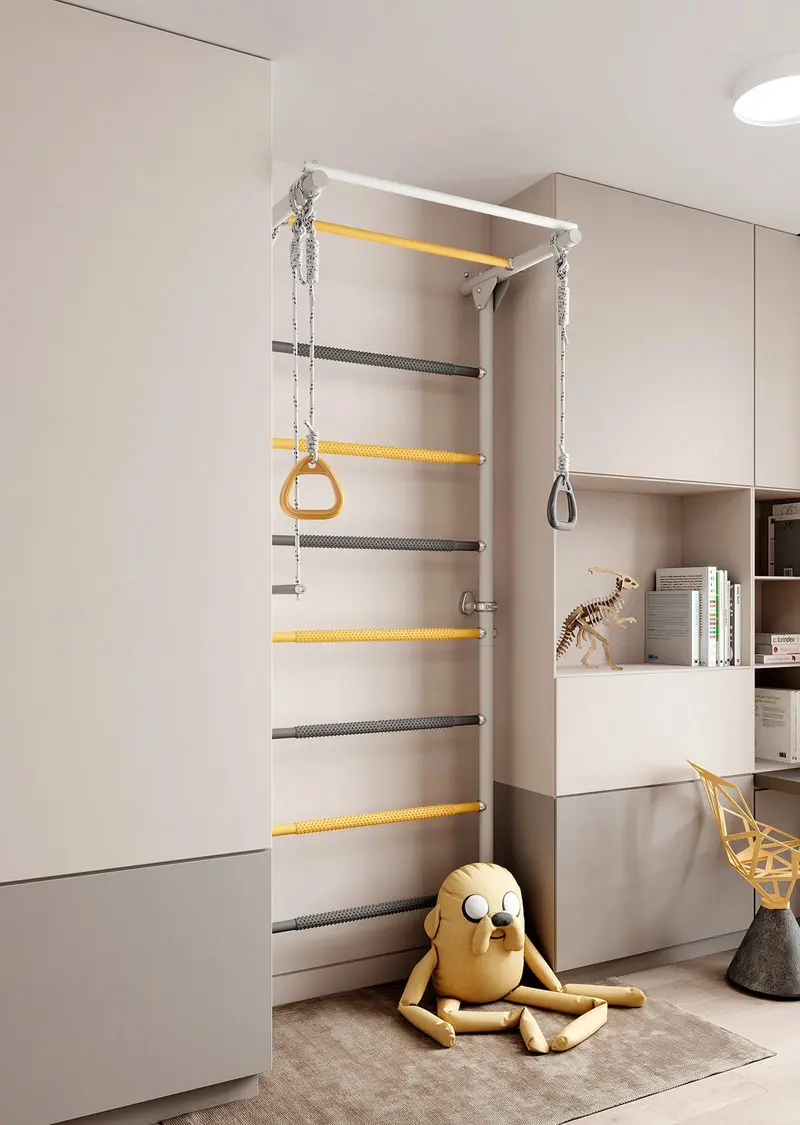Bức tường leo núi của trẻ em đã được tô màu để phù hợp với phần còn lại của căn phòng