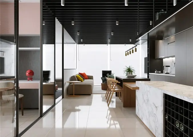 Một nửa đảo bếp bằng đá cẩm thạch được dành riêng để lưu trữ rượu vang, với giá đỡ chai màu đen tích hợp. Cửa trượt đảm bảo mùi thức ăn không làm ảnh hưởng đến các khu vực còn lại trong nhà.