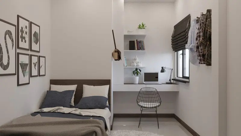 Phòng ngủ cậu con trai nhỏ nhưng bố trí gọn gàng và ngăn nắp. 