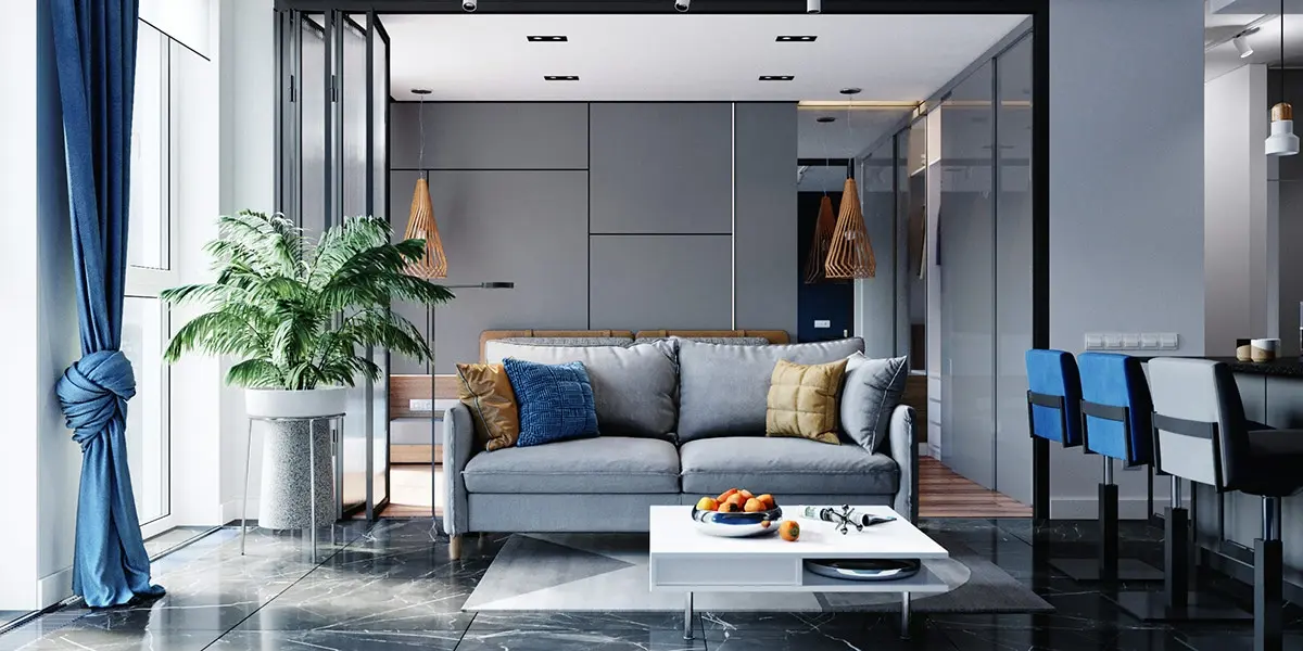 Nội thất phòng khách màu xanh lam, kết hợp điểm nhấn là gối tựa màu vàng và cây xanh trang trí
