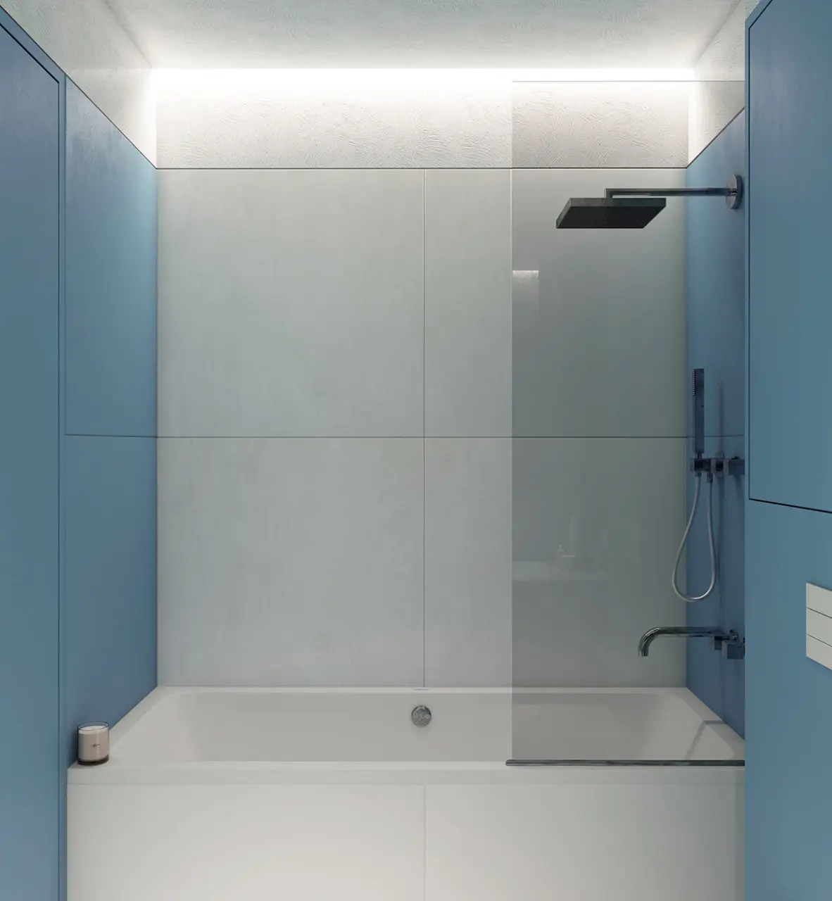 Gạch ốp tường lớn phá vỡ màu xanh lam phía sau bồn tắm .