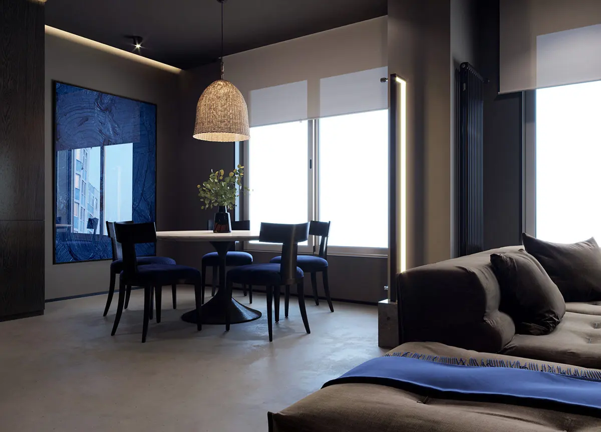 Một chiếc đèn sàn hiện đại làm nổi bật điểm chuyển tiếp của combo phòng khách phòng ăn