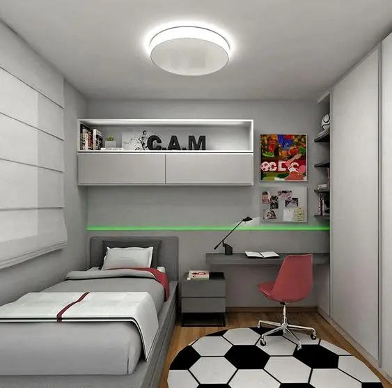 Gọn gàng, ngăn nắp, khoa học là những gì mà ý tưởng decor phòng ngủ nhỏ này đang đem lại. Giường đơn thiết kế nhỏ gọn, tận dụng không gian tường theo chiều cao, giá sách treo tường và bàn học treo đã được ứng dụng. Tủ quần áo thiết kế âm tường với cánh mở trượt, vừa thuận tiện cho việc sử dụng trong căn phòng nhỏ, vừa tiết kiệm tối đa diện tích một cách hoàn hảo. Không gian với gam màu trung tính, thích hợp cho những bạn nam cá tính.